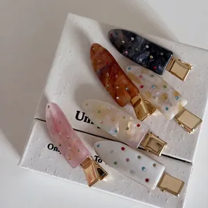 Set of 6 colorful rhinestone acetate hair clips with marble texture on gold metal bases