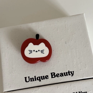 Cute red apple hair clip with white cat face design made of smooth acrylic acetate