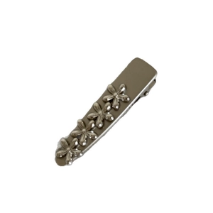 Chic silver metal hair clip with four 3D floral accents for a minimalist hair accessory