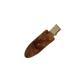 Brown tortoise shell acetate hair clip with colorful rhinestones on a white background