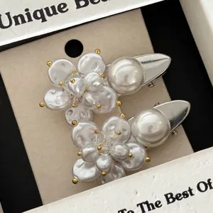 Elegant French pearl flower hair clips with silver metal base and retro floral design