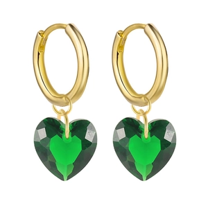 Detail of green faceted heart charms with polished gold metal earring hoops