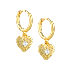 Detail showing S925 hallmark on golden heart earrings with radiant texture and zircon
