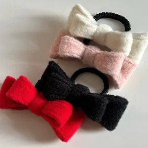 Detailed view of high-elastic wool hair ties with elegant double-layer bow design