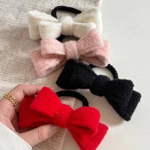 Four-color velvet bow hair ties set in cream, pink, red, and black for elegant ponytails