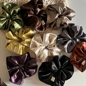 Set of 9 colorful satin scrunchies in glossy french fabric for elegant hair styling