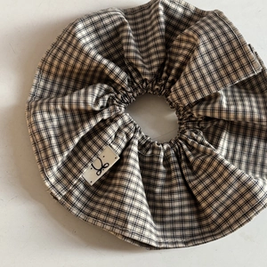 Classic black and white plaid scrunchie made of soft fabric for sweet hair styling