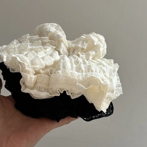 Set of large black and off-white layered lace hair scrunchies with elegant ruffled edges