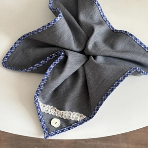 Blue and gray checkered lace fabric scrunchie hair accessory with white button detail