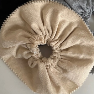 Beige suit fabric scrunchie with wave edge design for a minimalist hair accessory style
