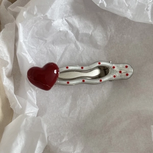 Polka dot hair clip with heart detail and white lace pattern on silver metal base