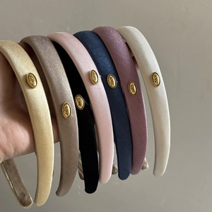 Lustrous satin headbands with gold love labels in multiple vintage colors set