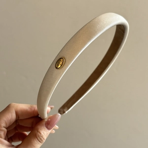 Elegant beige satin headband with gold oval metal love charm for women accessories