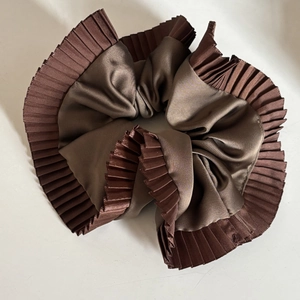 Elegant dark brown pleated scrunchie with a satin core and textured organza ruffled edges