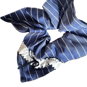 Navy blue striped scrunchie with lace ruffle and black bow for vintage style hairstyles
