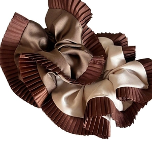 Elegant chocolate and cream satin scrunchie with pleated edges and silky texture