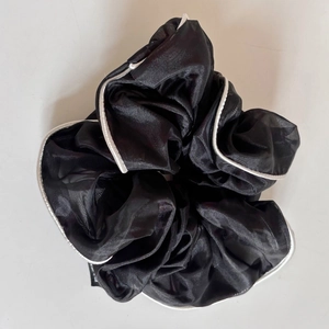 Elegant oversized black organza scrunchie with white trim for a stylish hair style