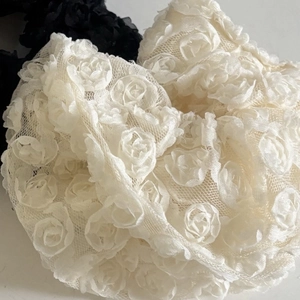 Elegant lace flower scrunchies in black and beige mesh with 3D floral details