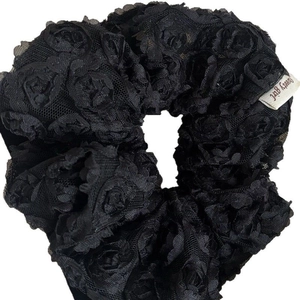 Elegant black lace scrunchie with 3D mesh rose floral patterns and white label