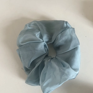 Elegant large blue organza scrunchie hair tie with textured pleats for ponytail styles