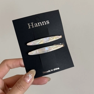 French style pearlescent acetate hair pins set with gold lettering on display card
