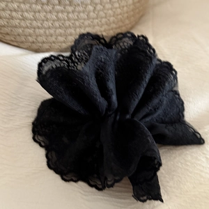 Handmade French vintage black lace scrunchie with multi-layer floral ruffles on white fabric