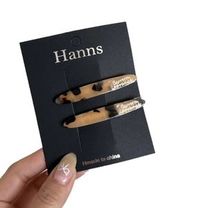 French style tortoise shell acetate hair clips with gold logo on two-piece set