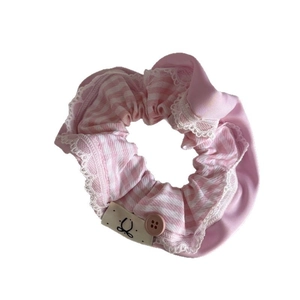 Pink striped scrunchie with lace trim and decorative button for high ponytail hair styling