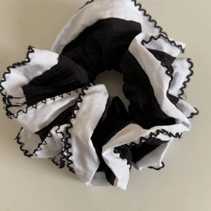 Monochrome large double-layered scrunchie with scalloped edges for elegant ponytails