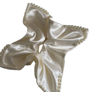 Elegant white satin scrunchie with pearl beads edge for a stylish ponytail look