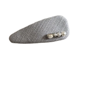 Minimalist grey fabric BB hair clip with three white pearls and a metallic buckle accent