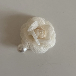 Elegant white camellia hair clip with lace layers and a large pearl accessory