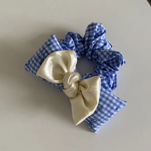 Blue and white checkered scrunchie with large cream satin bow and lace details