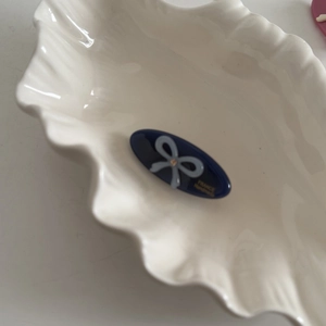 Blue acetate oval hair clip with bow pattern and golden France Handmade logo