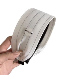 French style striped wide headband with Paris button detail in cream and black