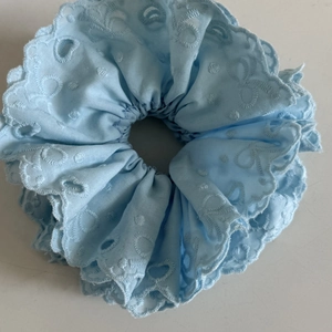 Ballet style light blue lace eyelet scrunchie with embroidered scallop edge design