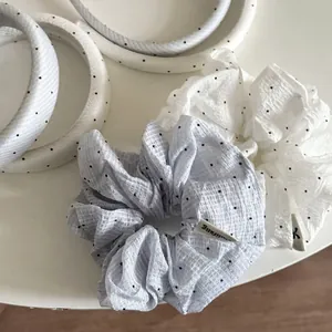 Elegant blue striped and polka dot scrunchie with matching headband hair accessory set