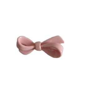 Sweet pink acrylic bow hair clip for girls with a glossy finish on white background