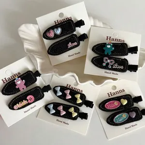 Sweet denim bow hair clips with resin bears and letters on white display cards