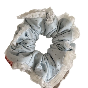 Light blue cream star lace scrunchie with white wavy borders and soft cotton fabric texture