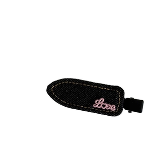 Sweet denim hair clip with yellow stitching and pink Love embroidery in navy blue fabric