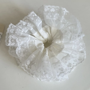 Elegant white organza scrunchie with lace embroidery and ruffled heart pattern