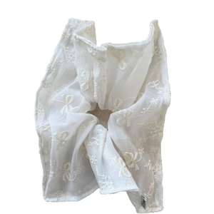 Large white mesh scrunchie with delicate floral embroidery and sweet bow patterns