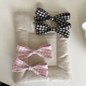 Süße Haarklammern Set mit karierten Schleifen in Rosa und Schwarz für Damenhaarschmuck