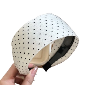 Classic white wide headband with black polka dots, retro fabric hair accessory for women