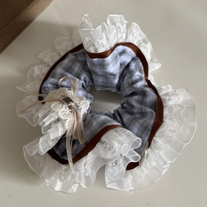 Blue plaid scrunchie with white lace edges, brown ribbon trim and delicate bow charm