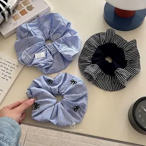 Blue and white striped scrunchie set featuring bow embroidery and soft cotton texture