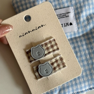Handmade blue floral hair clips set featuring cute bear patches on checkered fabric