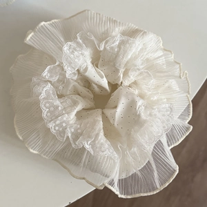 Detail shot showing retro polka dot lace scrunchie with French style mesh layers