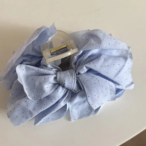 Light blue polka dot bow hair claw clip with lace texture and golden metal spring